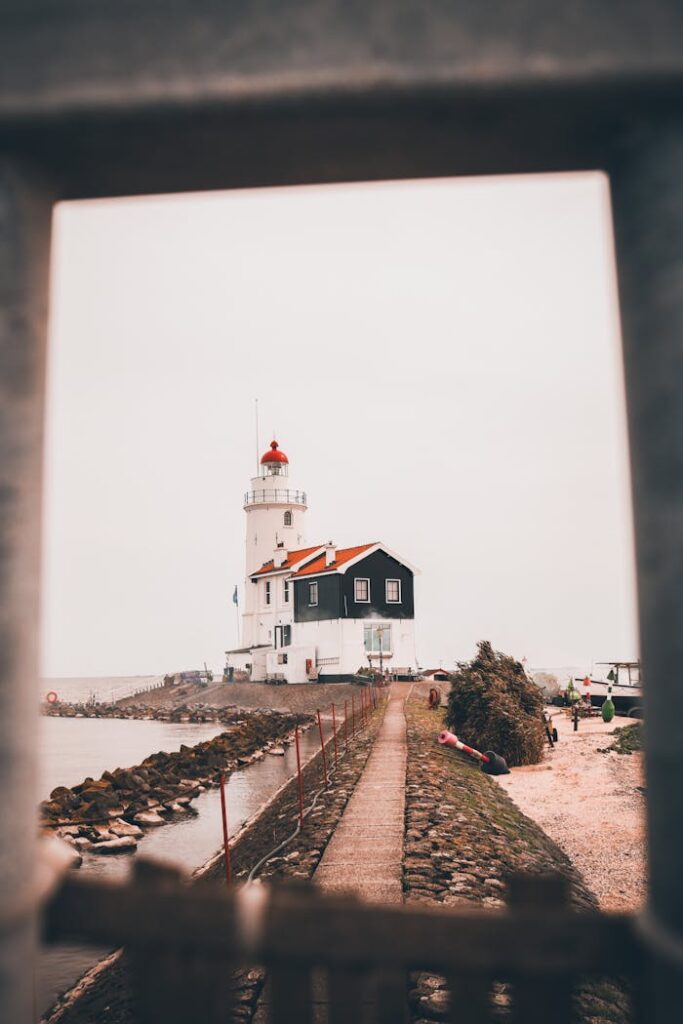 A lighthouse framed with fences, Marken, The Netherlands